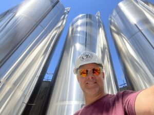 Mark LaClair installing new tanks at Seven Birches Winery