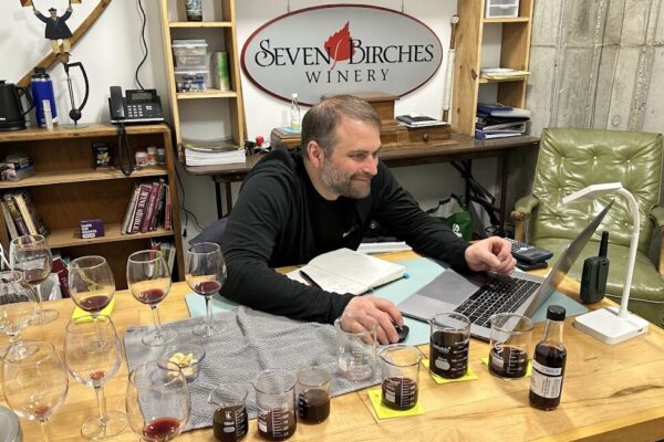 Winemaker at Seven Birches Winery, Blending Wines in Office